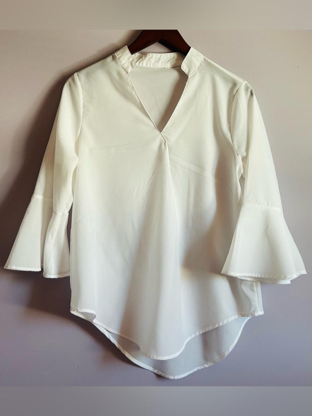 White blouse With Dramatic Bell Sleeves and Curved Hem Line Size Small